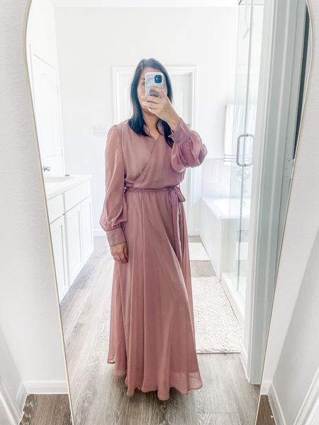 This dress is so flattering. It has sheer long sleeves with a button at the cuff, a tie belt and a sheet layer over the whole dress. The flowiness of this dress is a 10. Wedding and church approved.