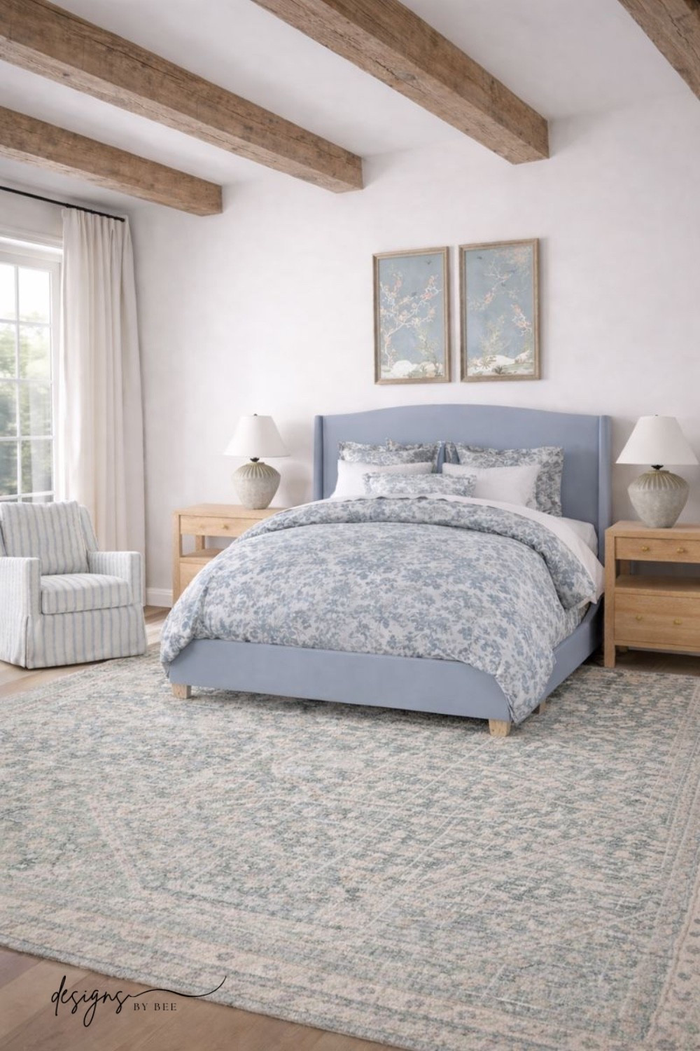 primary bedroom, bedroom decor, bedroom inspiration, coastal bedroom, blue and white bedroom, upholstered bed, blue bed, light wood nightstand, wood dresser, slipcovered chair, striped swivel chair, blue and green rug, vintage inspired rug, floral bedding, toile duvet, pleated curtains, hydrangea art, landscape painting, ceramic table lamp, traditional bedroom, coastal transitional, home decor, bedroom mood board 

 #LTKHome