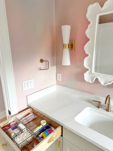 Can we agree that this girl’s bathroom is goals? The wallpaper is out of this world and details amazing. Of course, I’m here to link all the organizing products we used 



#LTKSpringSale #LTKhome #LTKbaby