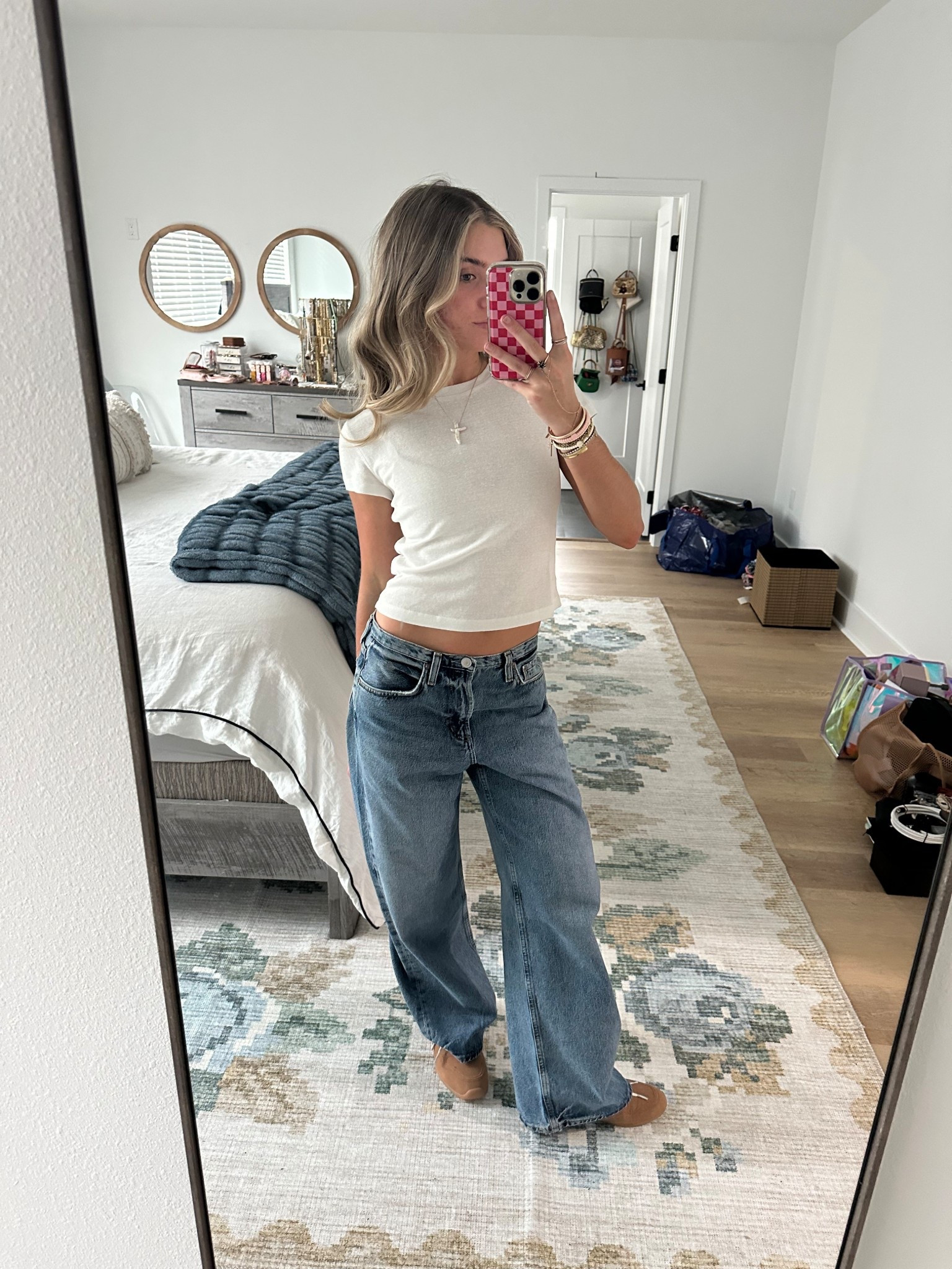 Airport travel outfit heading to LTKCON! My jeans I just got from aritzia they are Agolde Kiera Jeans size 23 so size down at least one I sized down two whole sizes. My baby tee is Cocolilly but I also have the Cuts one linked which is my favorite. My sneakers are new WALMART finds they are Miu miu look for less  

#LTKStyleTip #LTKCon #LTKTravel