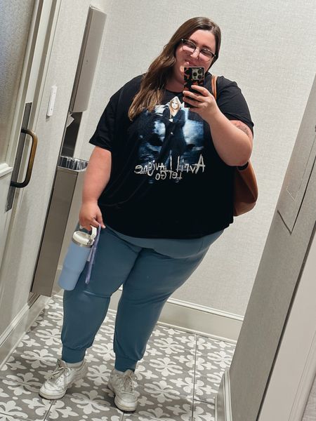 Plus size casual OOTD! Caroline is wearing a t-shirt from Torrid (5), a pair of Athleta Salutation Joggers (3X), Reebok sneakers, large tote bag from Amazon, Stanley flip-top cup, and Warby Parker glasses!

#LTKSeasonal #LTKstyletip #LTKplussize