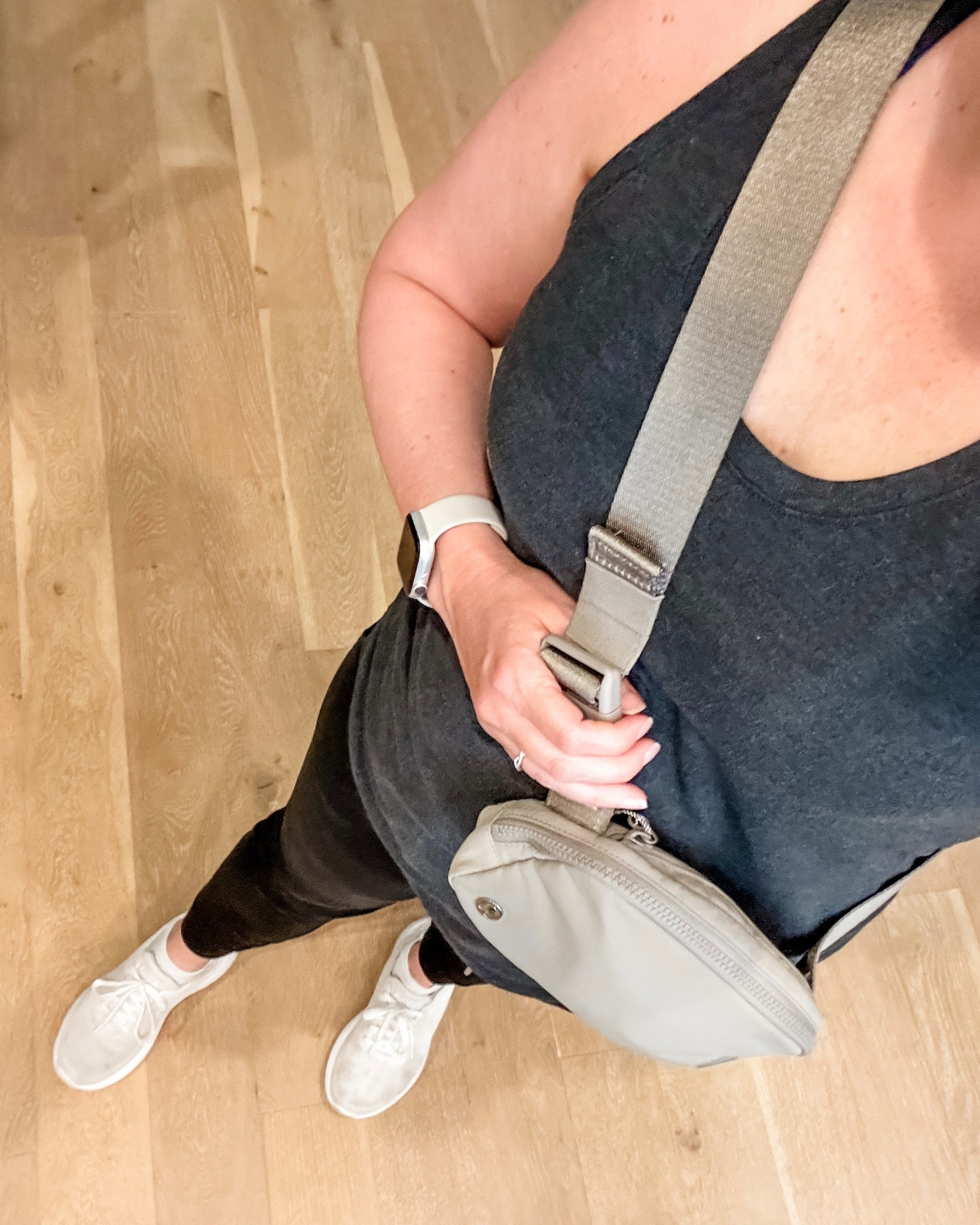 My mom on the go outfit for a quick The Sculpt Society workout and running errands. These black jogger pants are the perfect mix of comfy loungewear and elevated athleisure, easy to dress up or down. Paired with a dark gray workout tank, taupe belt bag and white slip on sneakers for a clean, effortless look. This is my go to spring athleisure outfit for busy days, post workout errands, and everyday mom style. 


#LTKmomlife #LTKActive #LTKootd
