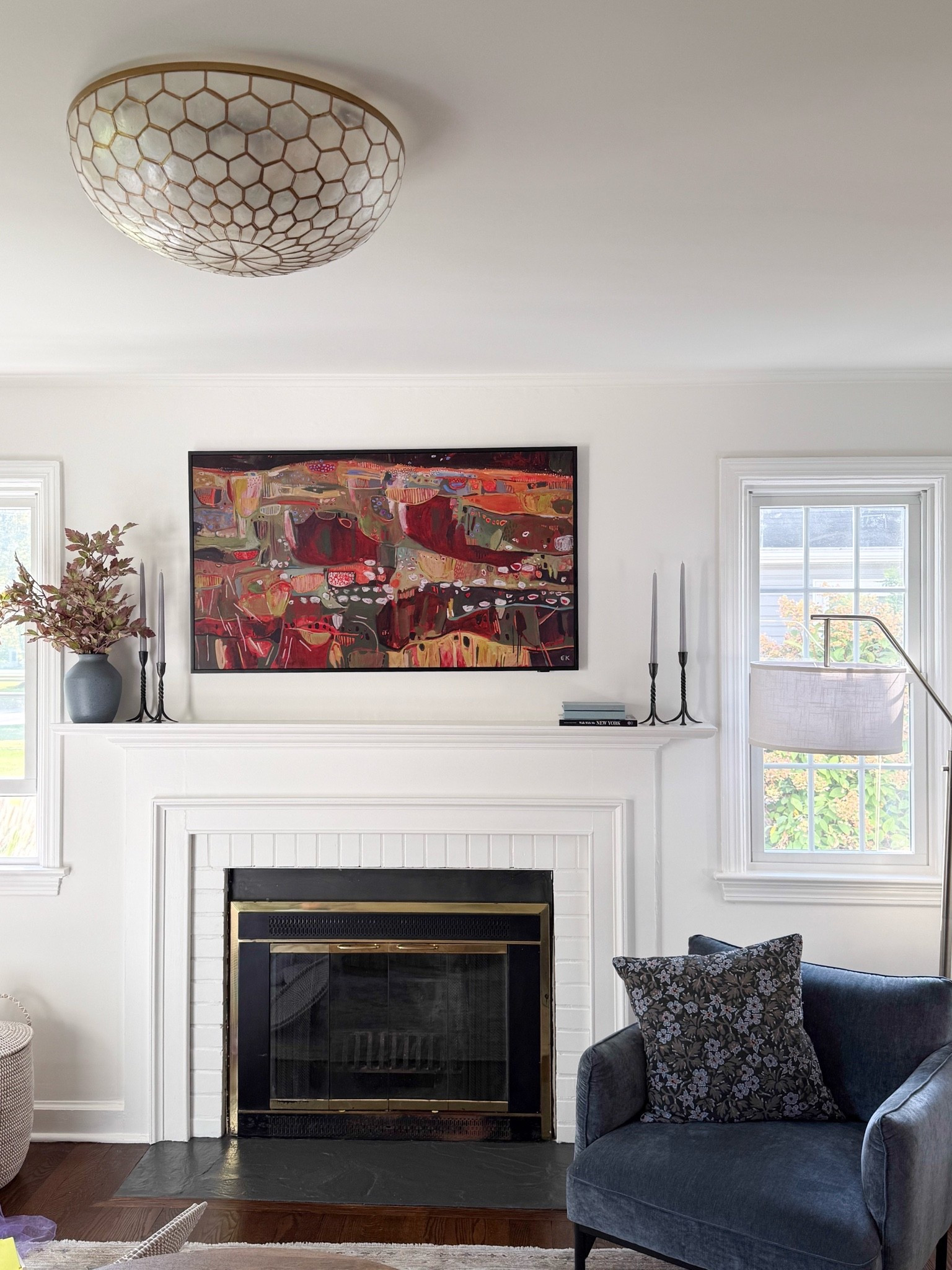 A little fall mantel refresh with a few of my favorite details. I love the contrast of the colorful artwork, classic black candlesticks, and autumn branches against the white fireplace. Proof that fall decor doesn't have to be all pumpkins!
fall mantel decor, fall fireplace styling, autumn branches, statement wall art, black candlesticks, living room decor, seasonal home accents, fall decorating ideas, classic home decor, colorful home decor, modern coastal home, girlonthehudson