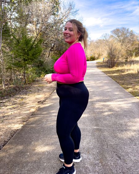 Lane Bryant seamless activewear — wearing 14/16 in all pieces. Hot pink long sleeve top, black leggings and low impact sports bra 

#LTKcurves #LTKfit
