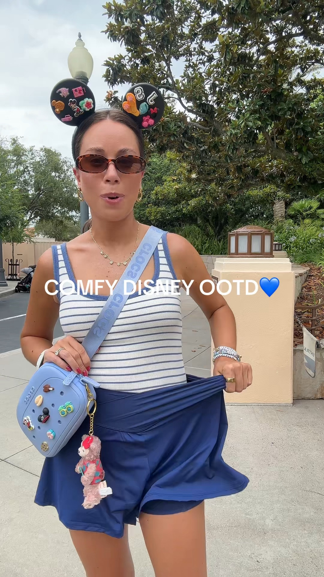 Comfy Disney ootd🩵 Amazon stretchy navy athletic shorts, active shorts, Abercrombie bra free padded stripe tank top, crocs Mickey Mouse ears, crocs Fanny pack, Disney bag, Disney accessories, Disney style, Disney girl, Amazon sunglasses, Disney jewelry, Reebok chunky sneakers #disney 



#LTKootd #LTKvlog #LTKxAbercrombie