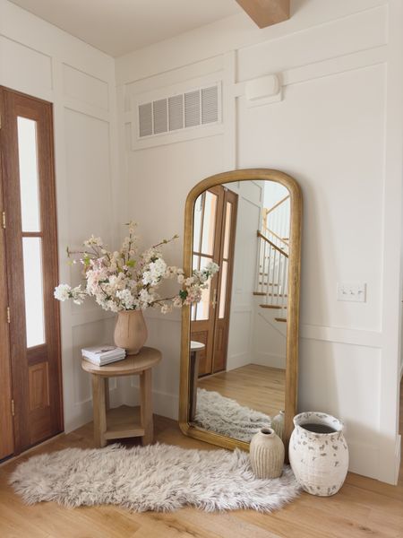 Light and bright spring entry way with faux florals, cozy textures, and gold details! This early spring look is perfect the transition from winter 

Spring refresh, entry way details, pops of pink, neutral home, light and bright, neutral wood tones, creamy whites, rug details, floor mirror, textured vase, side table, Pottery Barn style, gold detail, faux florals, decor book, entry way refresh, furniture favorites, shop the look!#LTKstyletip #LTKhome

#LTKSeasonal