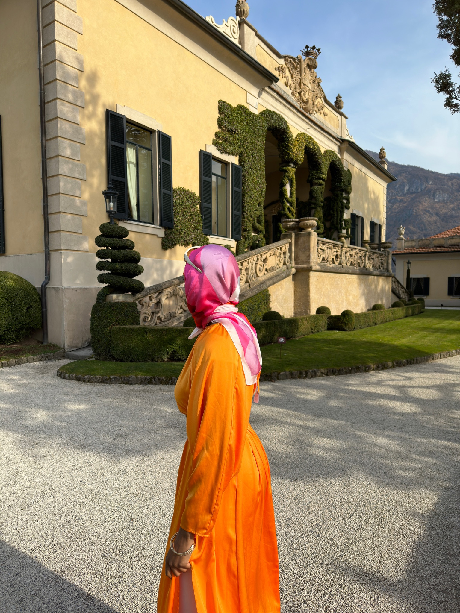 Modest Styling: Orange Maxi Dress (with an open back and slits) 

#LTKstyletip #LTKtravel