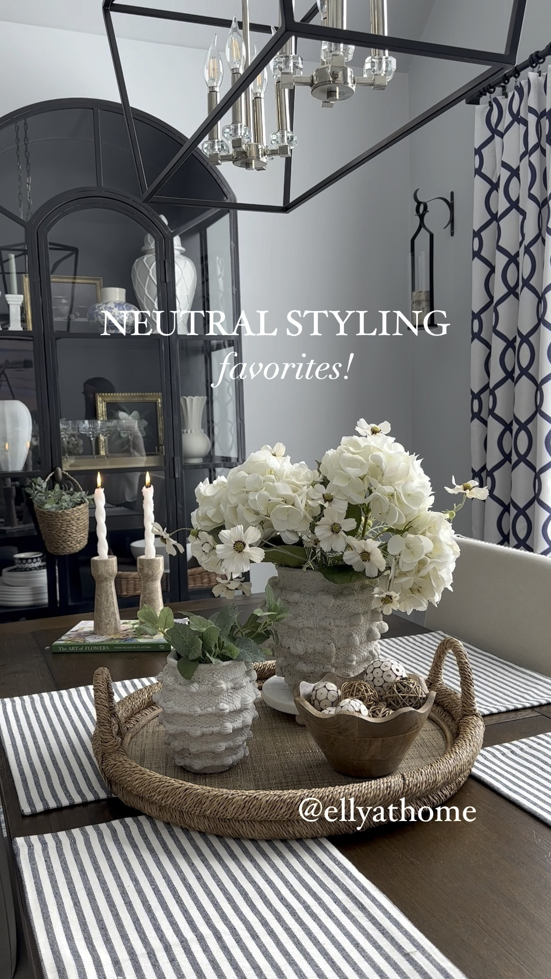 Summer neutral tray styling with best selling Minka vases, scalloped wood bowl, vase filler, coastal tray, marble candleholders, floral book, black glass display cabinet, elegant chandelier, white vases. White faux florals. Summer home decor accessories. 

#LTKHome #LTKVideo #LTKSaleAlert