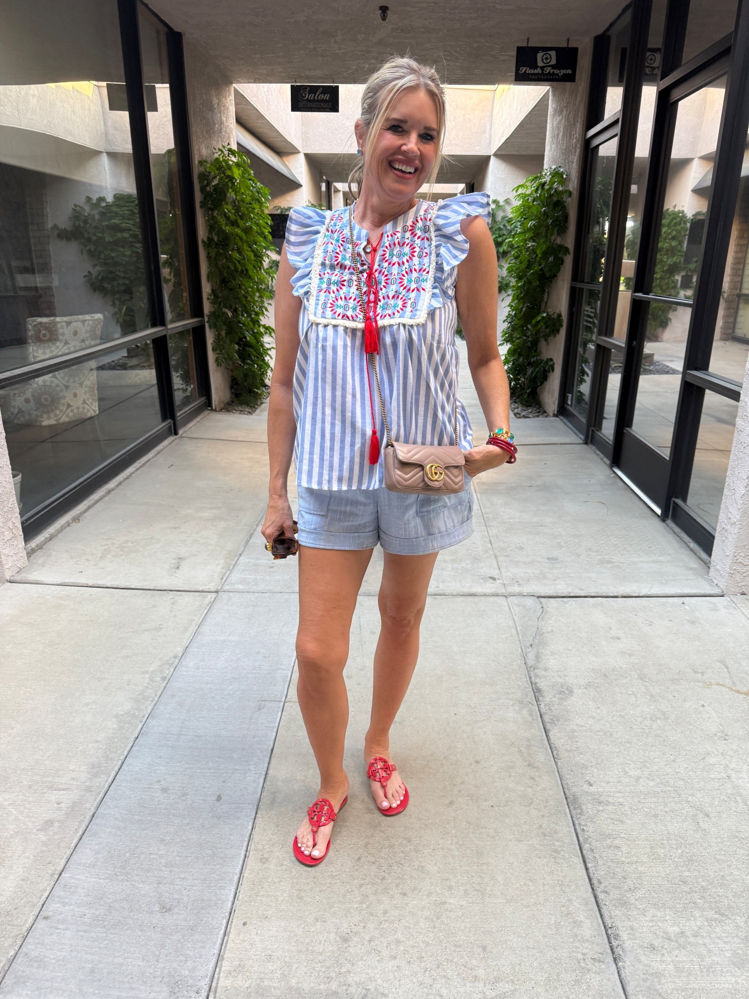 The cutest top and it’s under $30

The stripes, the embroidery details and tassels with a ruffle tank sleeve!! So cute and great quality fits tts wearing a small 

The perfect chambray/linen light blue shorts by Gibsonlook fit tts in a small save 10% off with code DARCY10 

Red Tory Burch millers 

Gucci marmot bag 

Julie Vos light blue stud earrings, necklace, ring and bracelets 

Red Budha girl bracelets all weather water proof

#LTKOver40 #LTKFindsUnder50 #LTKStyleTip