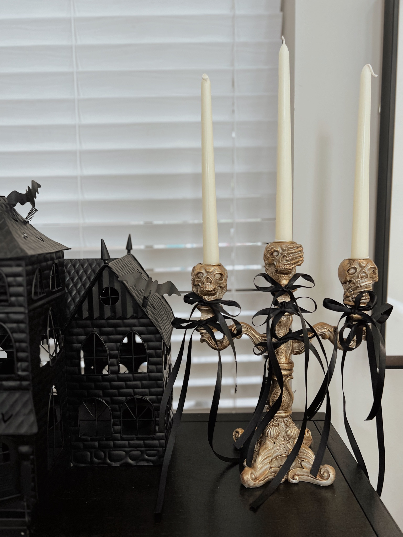 DO THIS to your candelabra 🤌🏼 chic and gothic. Obsessed. My candelabra is old Martha Stewart. My metal haunted house is old Yankee candle from my grandmother 🥹🤗 

Halloween DIY | Walmart Halloween | Target Halloween | Amazon Halloween 

#LTKHome #LTKSeasonal #LTKStyleTip