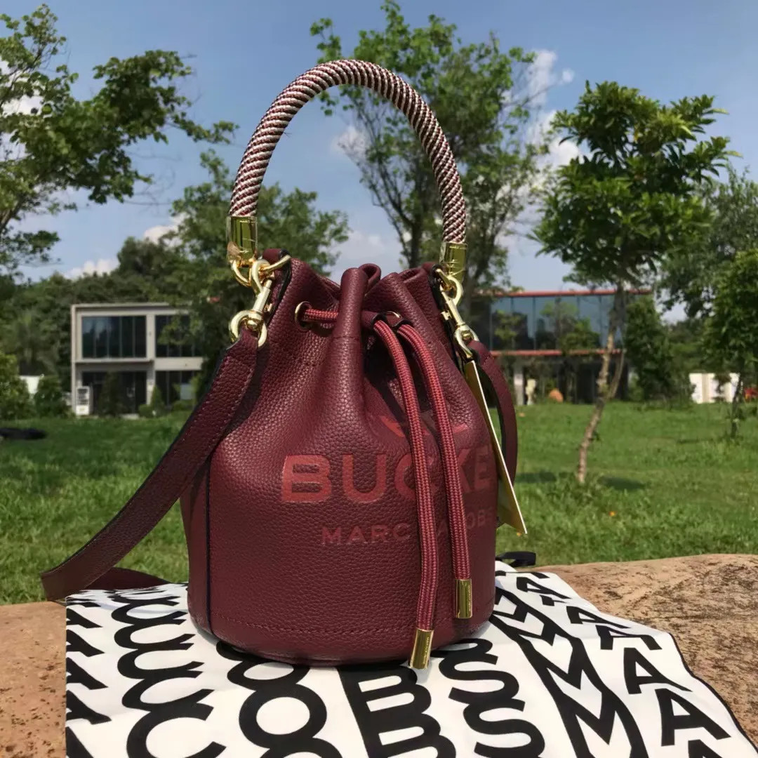 Top-Quality Dupe Marc Jacobs Buckle Drawstring Bucket Bag Women's Leather Handbag Shoulder Bag | DHGate