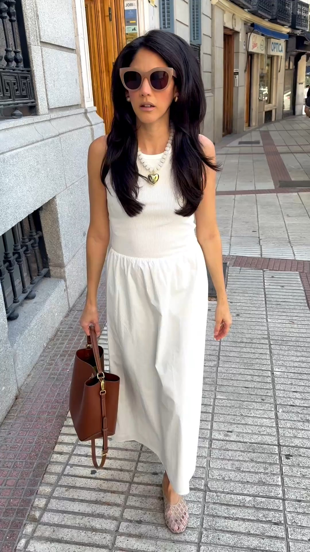 Basic pieces you love, that fit you well are the armor, these are the ones I reach for again and again and out the door in no time. This sleeveless white maxi dress is exactly that. No overthinking, just add a statement necklace and gold matching earrings. Jelly shoes because I may have retired the sandals this month already. Simple but never boring,

#LTKTravel #LTKootd #LTKPetite