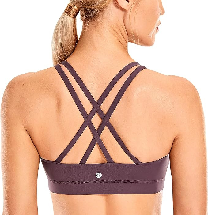 CRZ YOGA Women's Strappy Sports Bras Fitness Workout Padded Yoga Bra Criss Cross Back | Amazon (US)