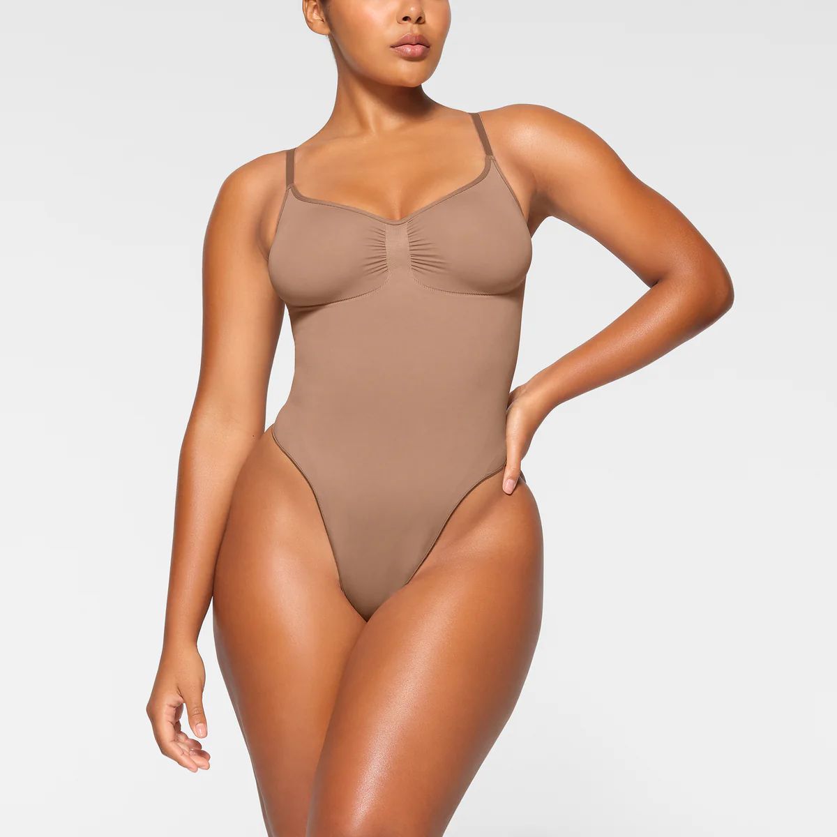 SEAMLESS SCULPTTHONG BODYSUIT$68 | SKIMS (US)