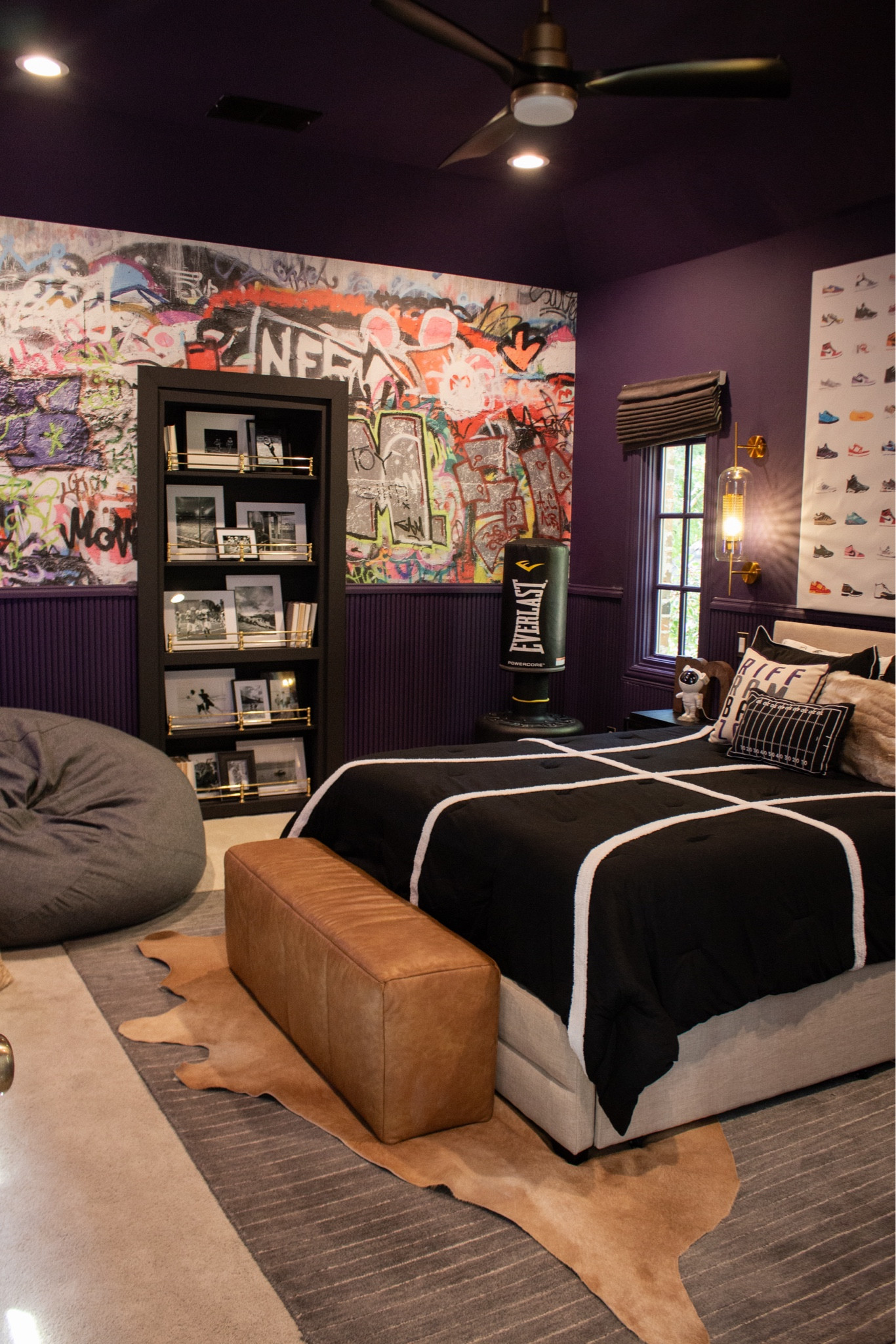 A bedroom that feels layered, bold, and intentional. Dark walls, mixed textures, and statement art give this space so much personality while still feeling grounded.

#LTKHome #LTKKids #LTKSeasonal
