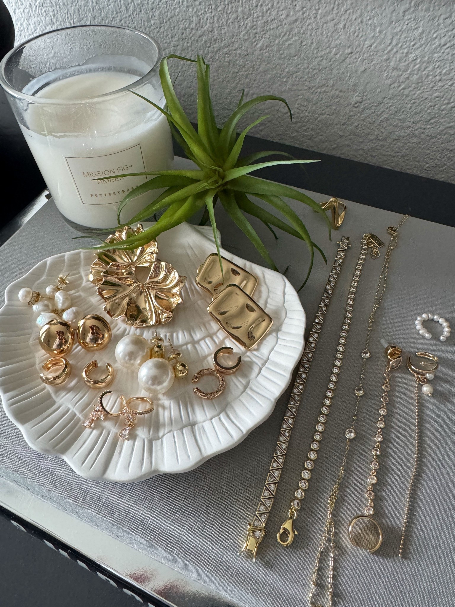 Favorite spring and summer jewelry I’ll be wearing all season long.. Some are dainty, some are statement, all superr pretty. Makes a perfect gift. 

Really into ear cuffs for the past year, and found a few by Ettika that are so unique and gorgeous. Will be wearing pearls with a modern twist again this year. And of course, can’t forget the architectural statement earrings. 

- Ettika - Molten Edge Stud Earrings
- Anthropologie - Metal Fluttered Post Earrings
- Adina Eden - Baroque Pearl Drop Earrings
- SHASHI - Gold Pearl Stud Earrings
- Ettika - Polished Pebble Stud Earrings in 18K Gold
- Amazon - MYEARS Ear Cuffs
- PAVOI - 14K Plated Tennis Bracelet Bezel
- Electric Picks - Jewel Bracelet 
- Amazon - Dainty Handchain 
- Ettika - Ear Cuff Crystal Chain Stud
- Ettika - Pearl Drama Ear Cuff Set
- Hey Harper - September Milo Ring


#spring #springoutfits2026 #womenspringoutfits #summer #summeroutfits2026 #womensummeroutfits  #traveloutfits #travel  #destinations #coastal #westcoast #coastalcalifornia #vacation #mediterranean #europeansummer #essentials #basics #staples #capsulewardrobe #minimalist #accessories #springaccessories #summeraccessories #jewelry #earrings #studs #earcuffs #huggies #statement #ring #bracelet #handchain #gold #ettika 

#LTKTravel #LTKSeasonal #LTKMothersDay