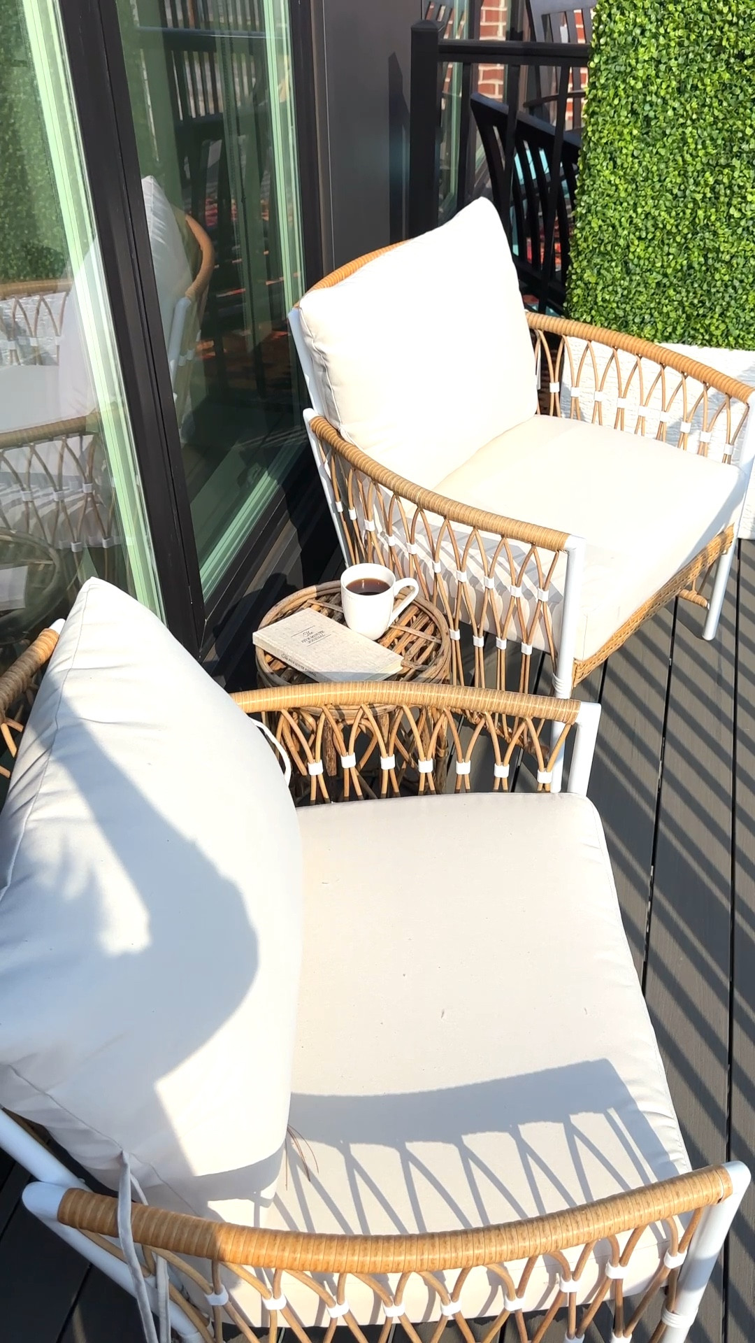 My apartment balcony! My chairs are both from Walmart! My boxwood hedge is Home Depot and I linked my side table! 