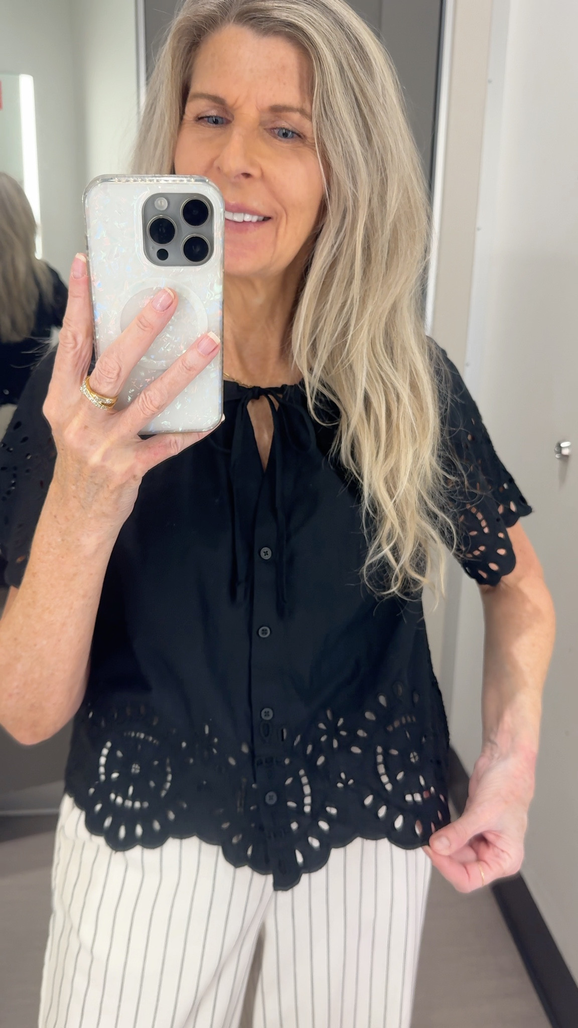 Target is so good lately - Short-sleeve eyelet top - 100% cotton - V-neckline with front ties and button-down front - Scalloped hem - wearing white with black pinstripe wide leg linen pants but also great with shorts or jeans. Versatile top for everyday, work wear, resort wear when traveling. Great Mother’s Day gift! Available in white and pick too! #eyelet 
#LTKMothersDay 

#LTKgrwm #LTKTravel