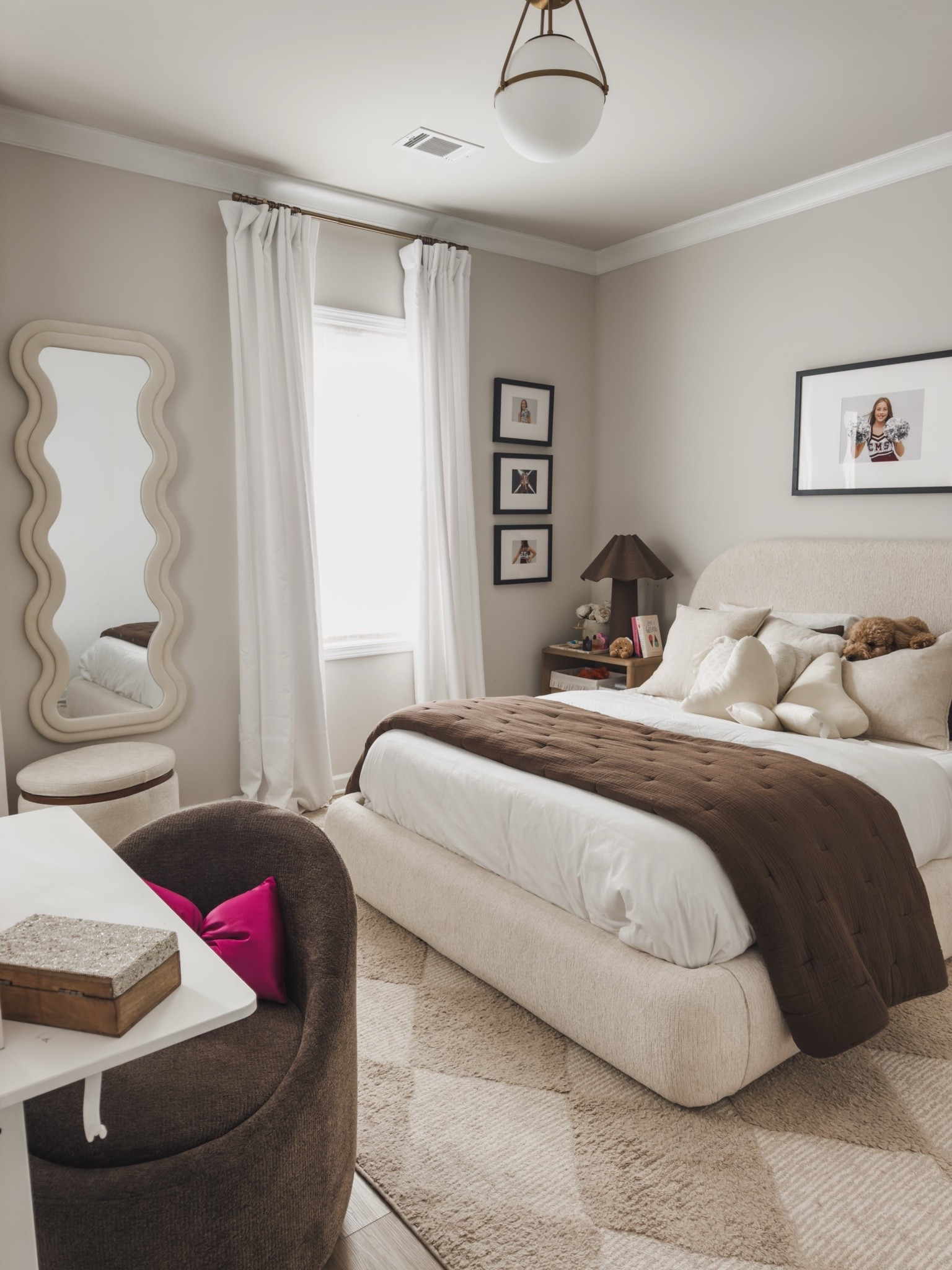 Light and airy teen girls bedroom! I love using furniture that is not only aesthetic but functional. Her bed lifts up and has storage underneath, the ottoman by her mirror holds all of her favorite cozy blankets and her desk chair also has storage!