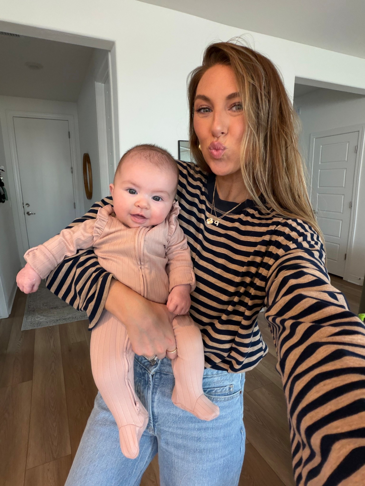 Easy mom outfit! Wearing a medium in the top and 4 in the jeans 