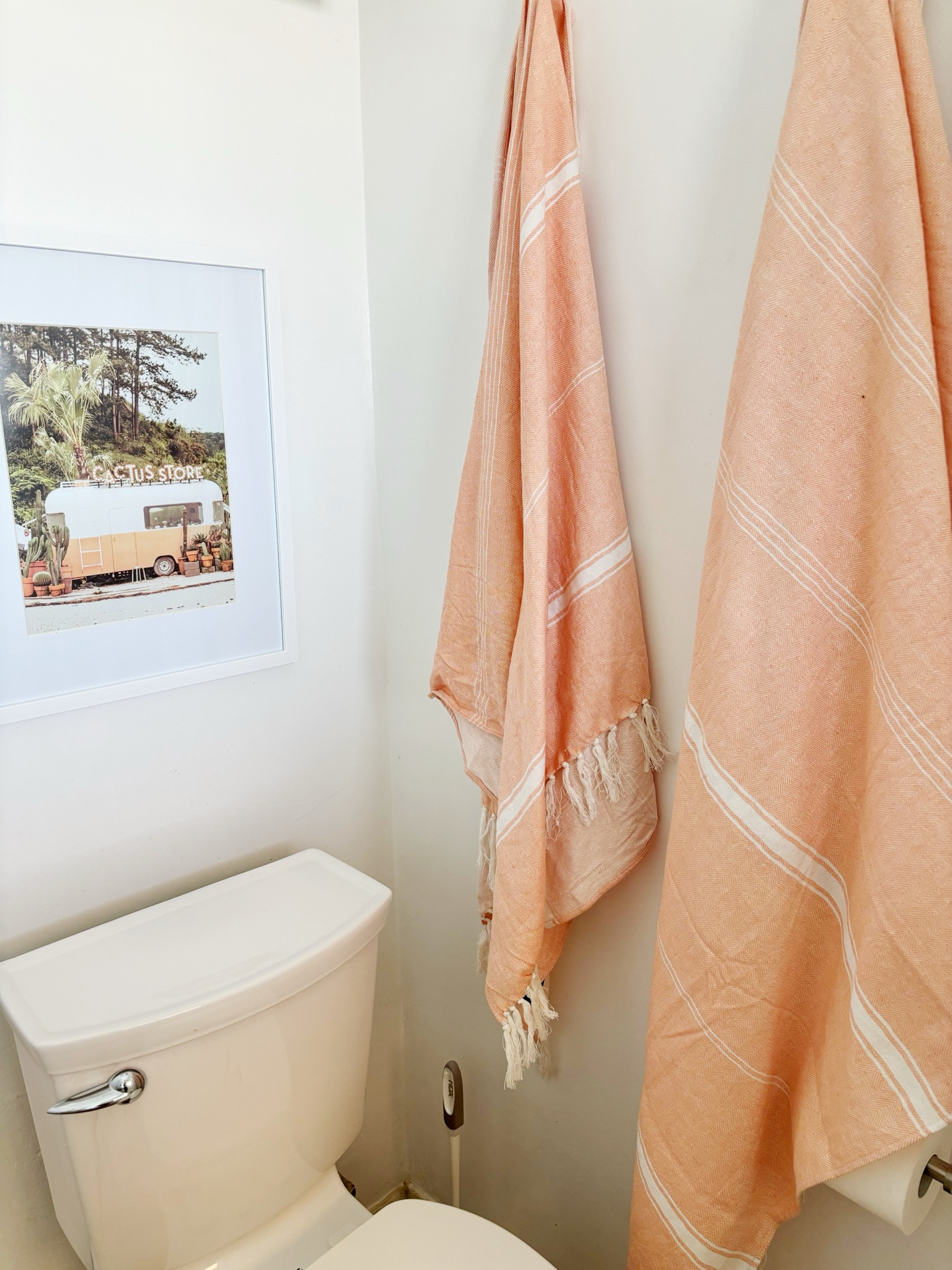 Added a little design moment to a tiny bathroom with colorful towels on hooks and a fun print off Etsy.  

#LTKHome #LTKTravel