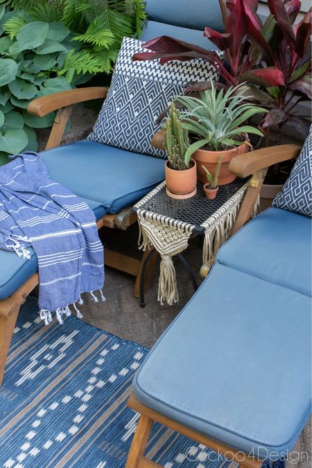 Wooden steamer lounge chairs are my favorite small scale outdoor loungers. I decorated them in blue with and Aztec outdoor rug and Aztec cushions. Also loving the blue Turkish towels | outdoor living | patio decor | outdoor seating 

#LTKhome #LTKstyletip #LTKSeasonal