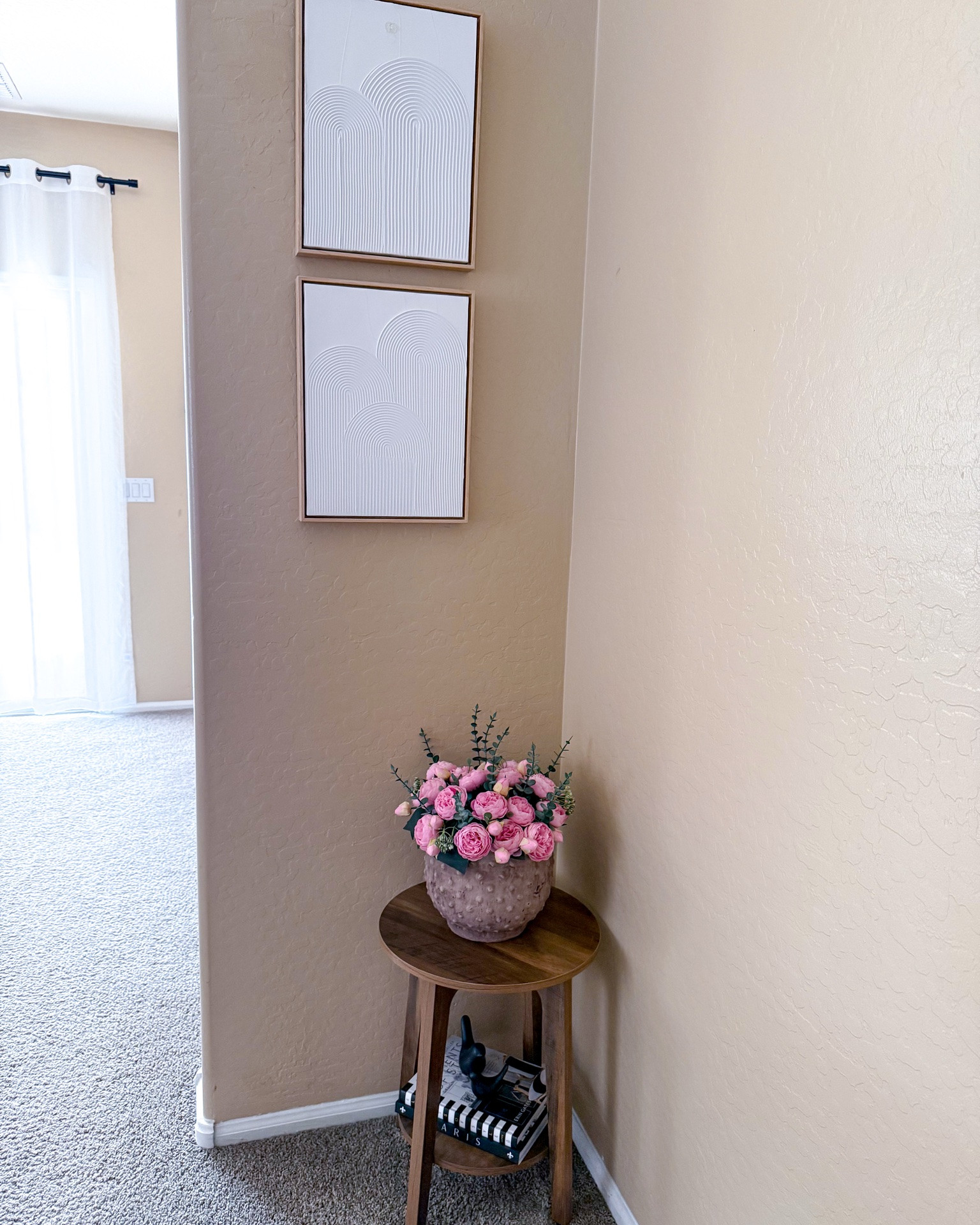 This cute two-tier side table from Amazon and wall art from Target create a charming corner styling in a small space. The table is sturdy enough to hold several books or decorative items.

#LTKSeasonal #LTKHome #LTKSaleAlert