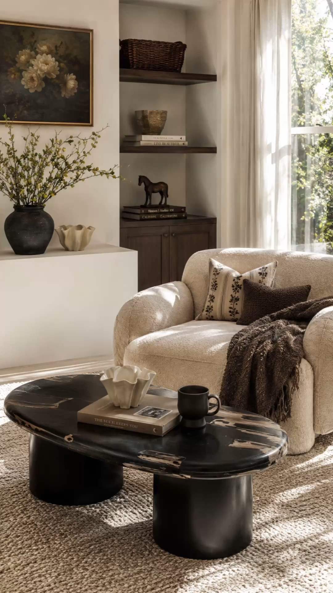 Some spaces don’t need a full makeover… just a few really good pieces. 🤎

The sculptural coffee table, oversized boucle chair, rich chocolate textures, and vintage-inspired accents completely transformed this corner into something that feels warm, elevated, and lived-in.

This is your sign to stop overlooking statement pieces when styling your home.

#LTKHome #LTKSaleAlert #LTKSeasonal