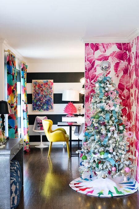 Flocked Christmas tree with lots of color. #wallpaper #christmastree #flockedtree #diningroom #christmasdecor 

#LTKHoliday #LTKSeasonal #LTKhome