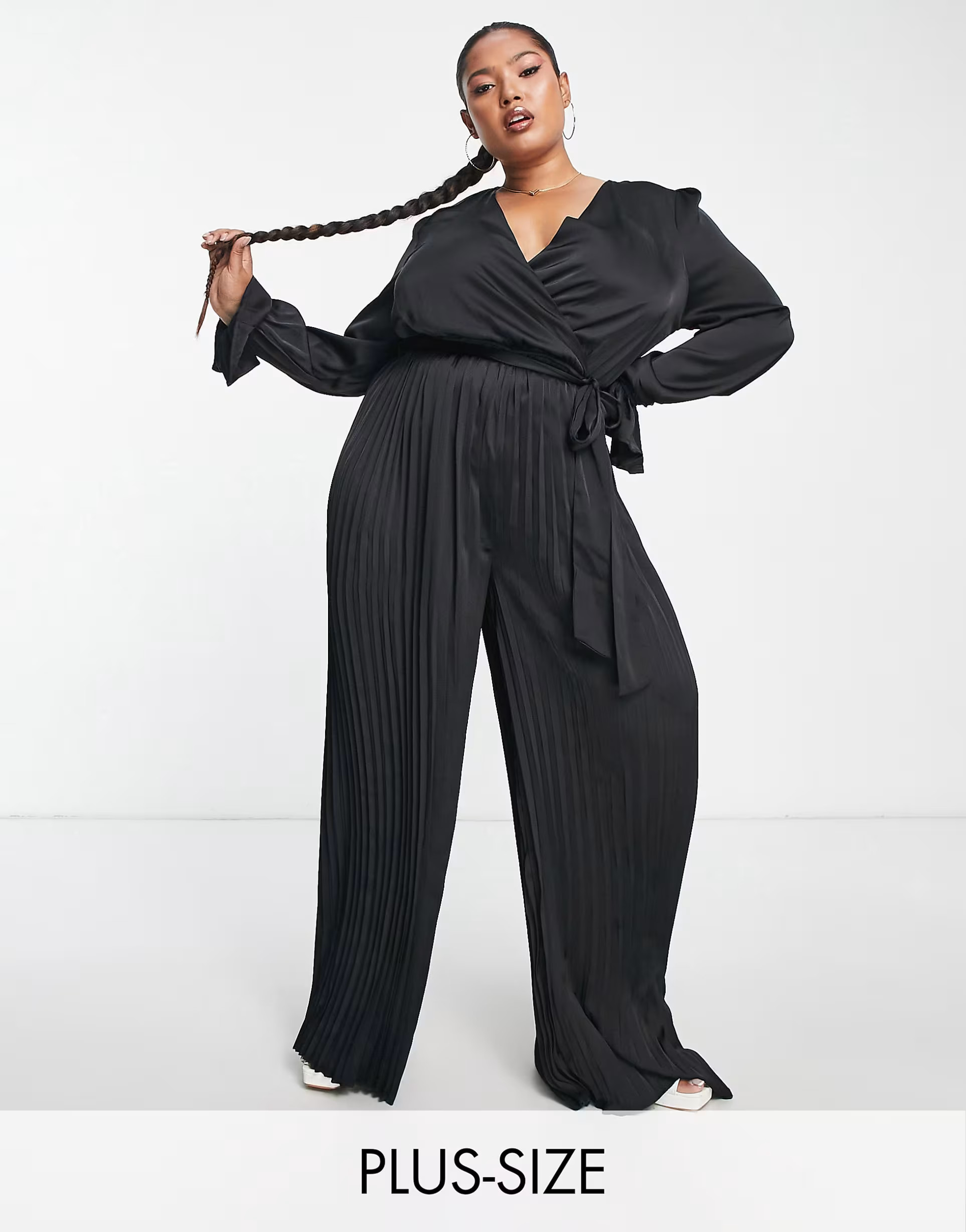 In The Style Plus exclusive satin wrap detail pleated wide leg jumpsuit with belt in black | ASOS (Global)