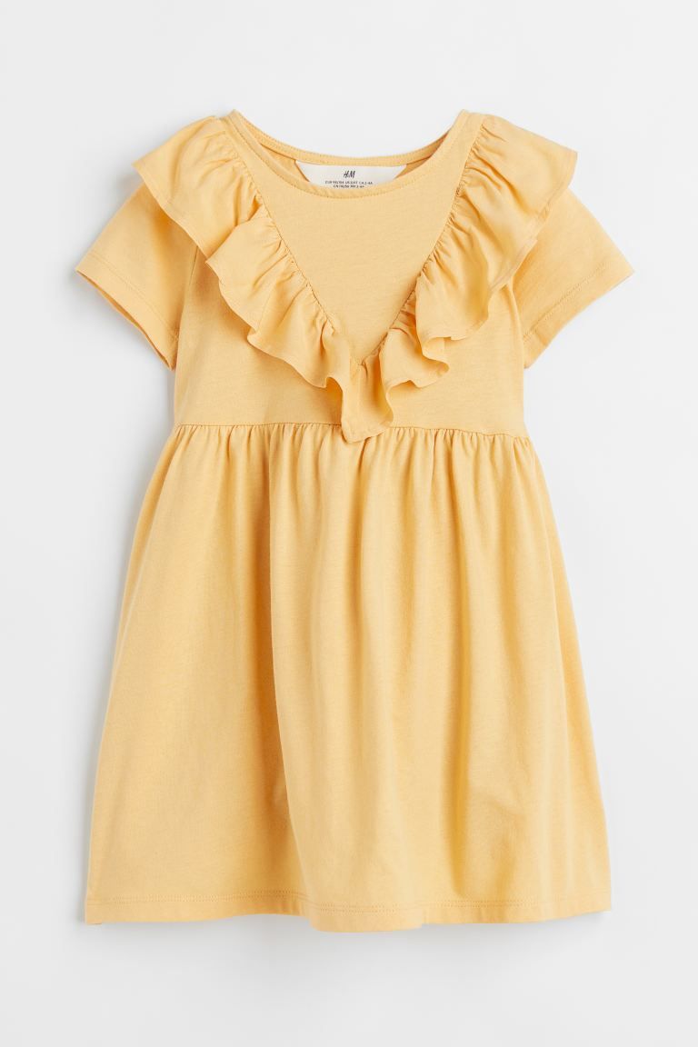 Short-sleeved dress in cotton jersey. V-shaped flounce in poplin at top extending over shoulders ... | H&M (US + CA)