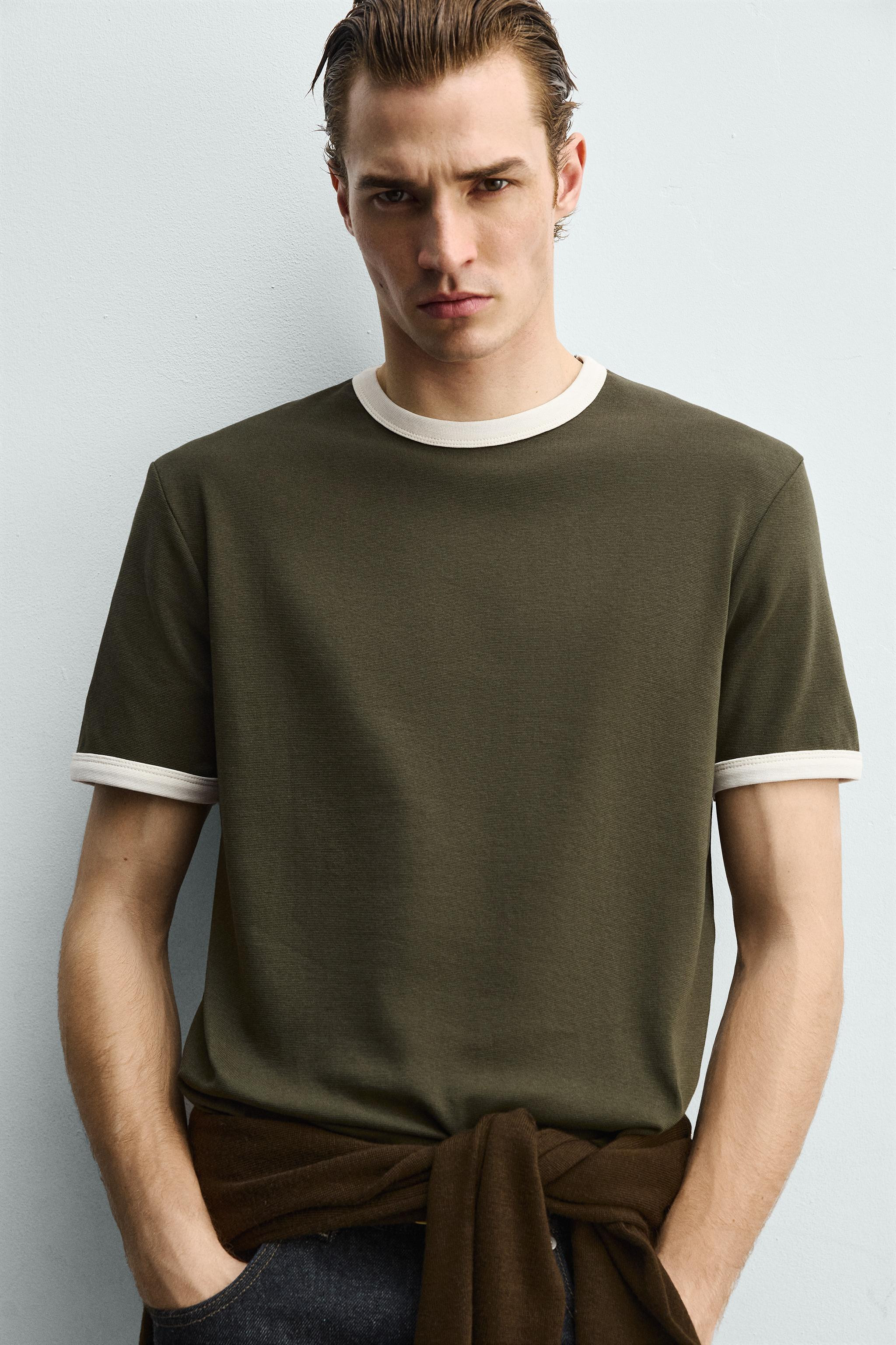 Regular fit T-shirt. Round neck and short sleeves. Finished with contrasting trim. | Zara US
