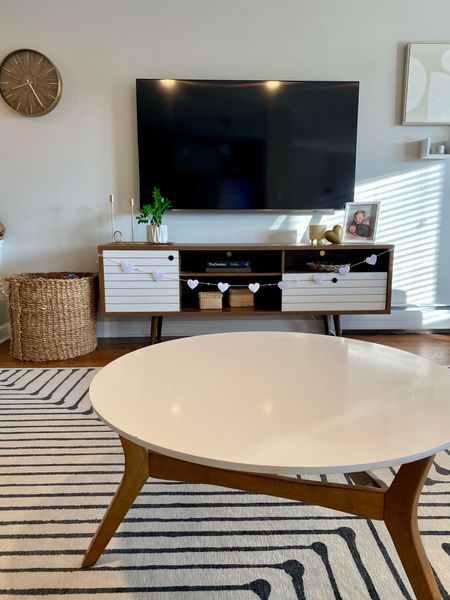 Living Room
midcentury modern | coffee table | ruggable rug | tv stand | Valentine’s Day home decor

#LTKhome #LTKSeasonal #LTKsalealert