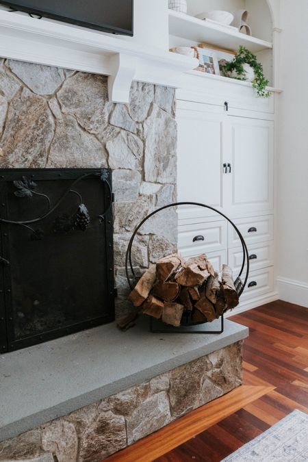 Keep your fireplace cozy and organized with this rustic firewood holder #FireplaceEssentials

#LTKHome