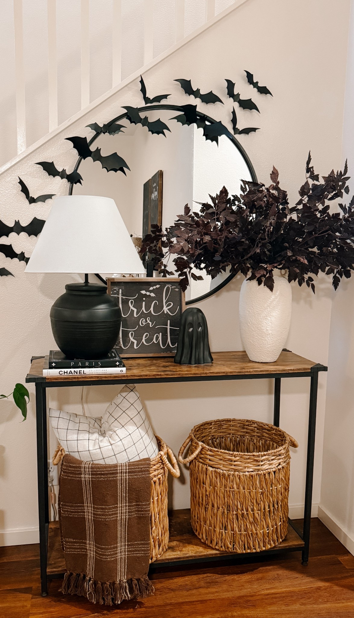 ✨ Spooky + simple entryway vibes ✨
Beautiful fall stems, a textured vase, a sweet little ghost, and bats floating across the mirror for just the right touch of Halloween magic. 🦇🤍

#LTKHome #LTKStyleTip #LTKSeasonal