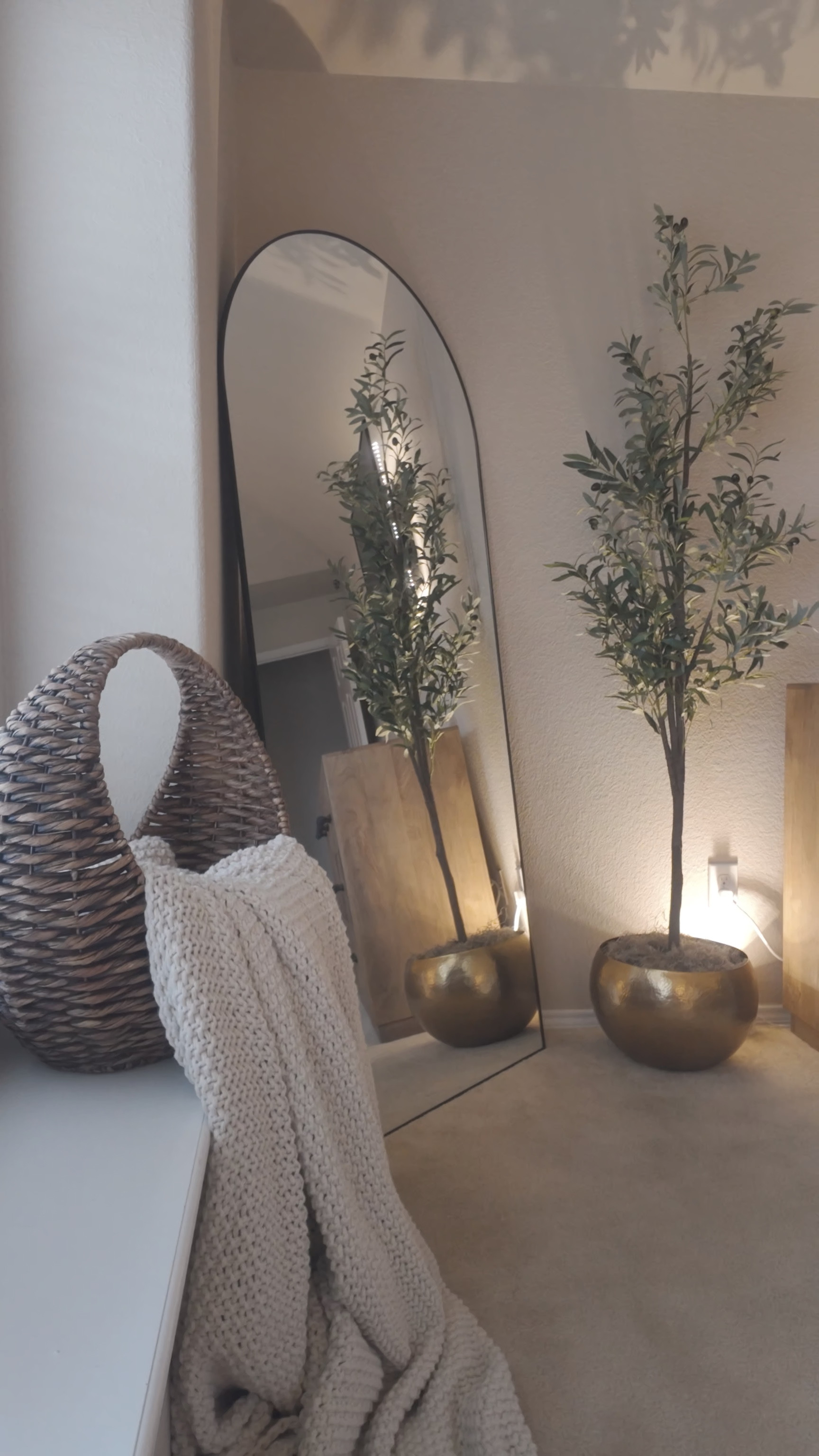 Some staple pieces that give our bedroom the cozy oasis feel. The woven  crescent basket was purchased years ago from either kirkland’s or pier 1. The hammered gold planter was from world market and is currently oos. 
The mirror frame is thin but very tall. Worked for us!

#LTKHome