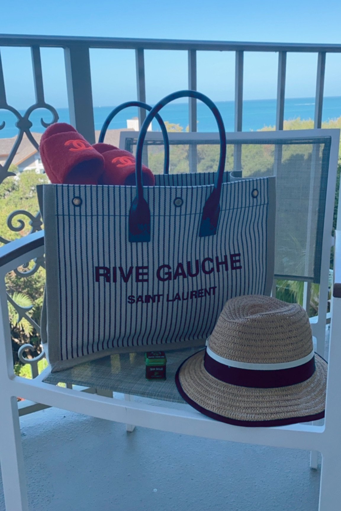 Beach day essentials…YSL bag that is SO WORTH IT! Hat because no wrinkles & lip balm, duh 👏