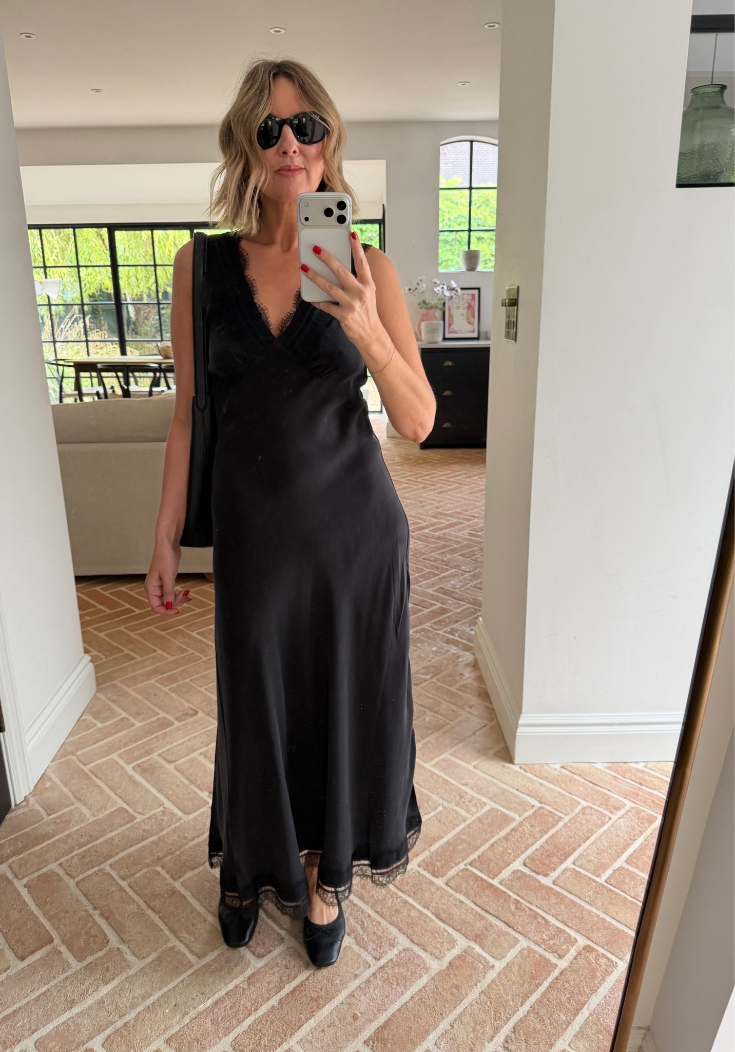 black slip dress, silk slip dress, lace trim dress, lace hem maxi dress, v neckline dress, bias cut dress, satin maxi dress, black maxi dress, evening slip dress, black ballet flats, mary jane flats, black leather tote, shoulder bag, black cat eye sunglasses, mirror selfie ootd, effortless summer style, elevated basics, quiet luxury, evening wear, date night outfit, black on black styling, minimalist evening look, ltkstyletip, ltkseasonal, ltksummer, ltkfindsunder100, ltkbeauty, ltkitbag

#LTKluxury #LTKeurope #LTKdresses