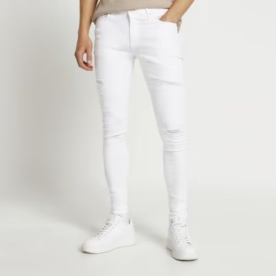 White ripped spray on skinny fit jeans | River Island (UK & IE)