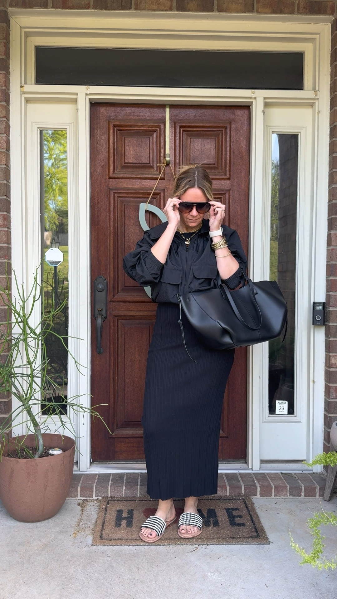 OOTD for a day of errands and client shopping ✨ Black ribbed midi dress + black windbreaker + Jack Rogers black and ivory beaded slide + bracelet stack + necklace stack + black tote. Most of these pieces are still shoppable — linked everything below! 👇

#LTKOver40 #LTKootd #LTKdayinmylife