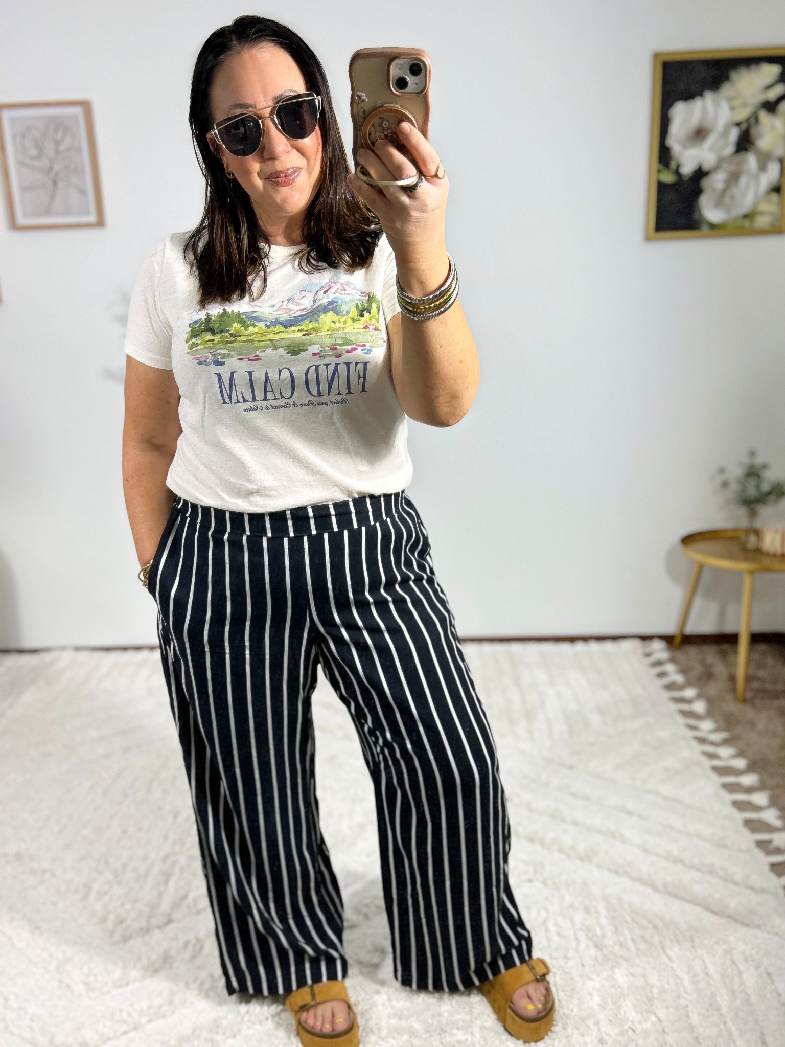 Easy mom life outfit of the day! Large graphic tee. XL wide leg pants. Sandals run true to size.  

#LTKootd #LTKMidsize #LTKmomlife