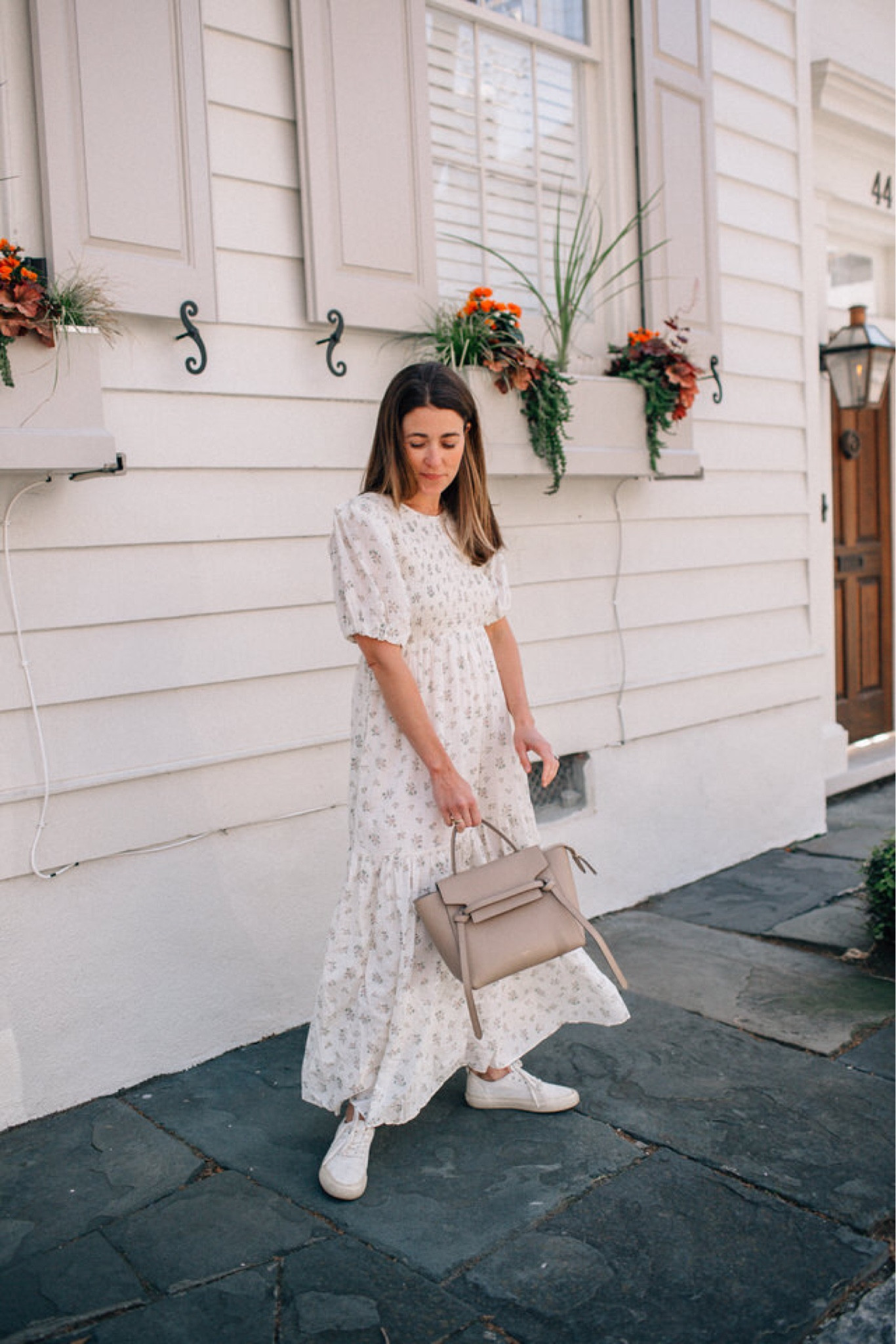 An easy outfit formula for spring: floral midi dress, white sneakers, and a simple bag 🌸 I can’t wait to start wearing outfits like this as the weather warms up! 

#LTKstyletip #LTKSeasonal #LTKitbag
