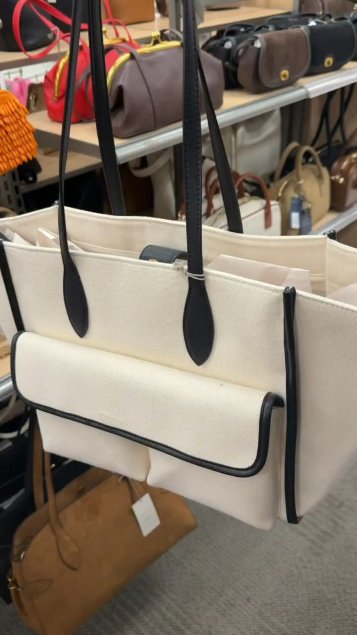 This canvas tote has such a clean, classic look with the black trim and structured shape. I love the roomy size for work, travel, or everyday errands, and the outside pockets make the little things much easier to grab.

canvas tote, black and white tote, work bag, travel tote, everyday handbag, structured tote, women’s tote bag, carryall bag, neutral handbag, fall accessories, TheMomInStyle

#LTKootd #LTKSeasonal #LTKOver40