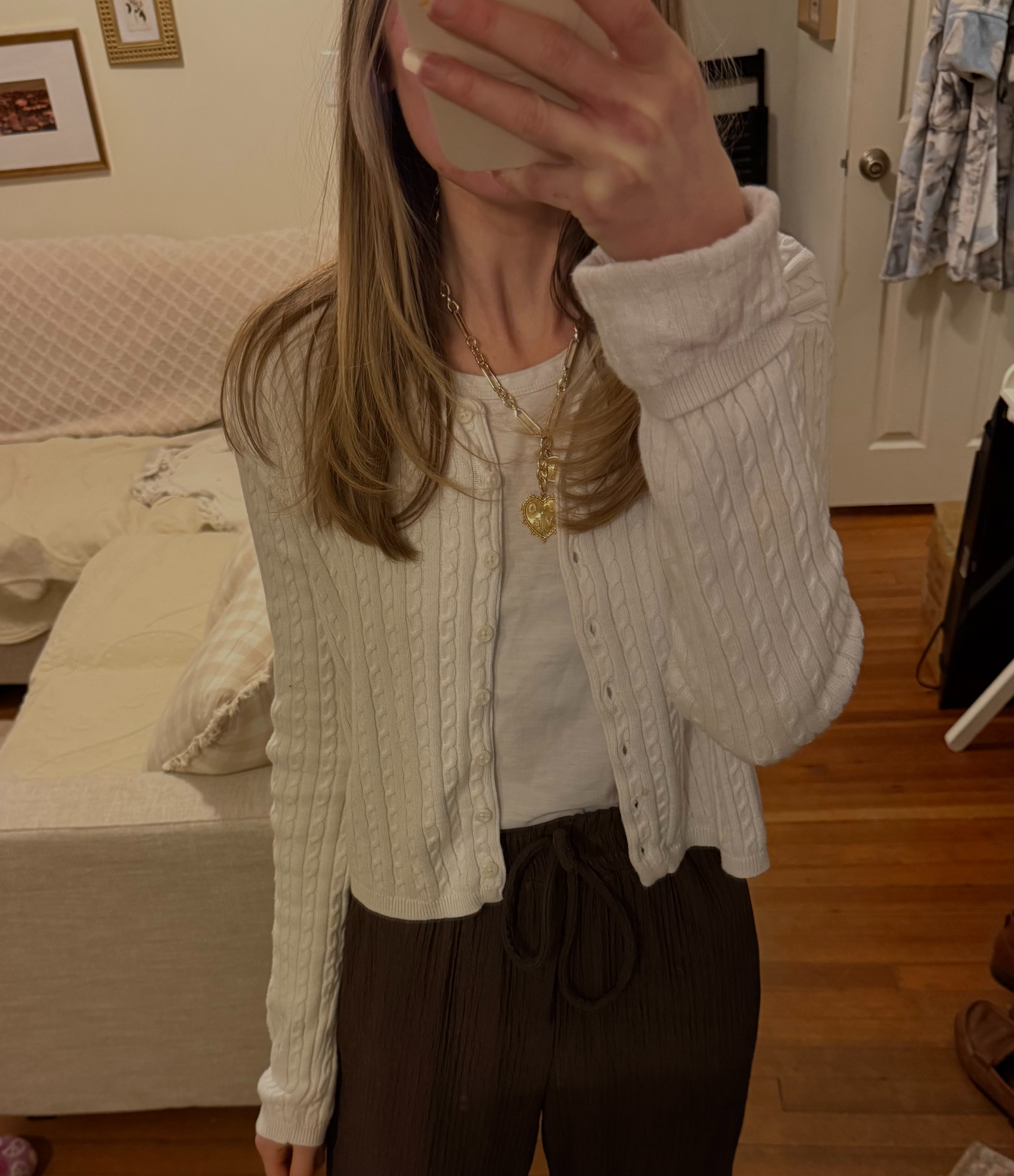 Work from home casual outfit 
j crew basics
straight leg trouser
white lightweight cable knit cardigan 
brown slacks
chunky necklace 
 

 #LTKFindsUnder50 #LTKStyleTip #LTKWorkwear