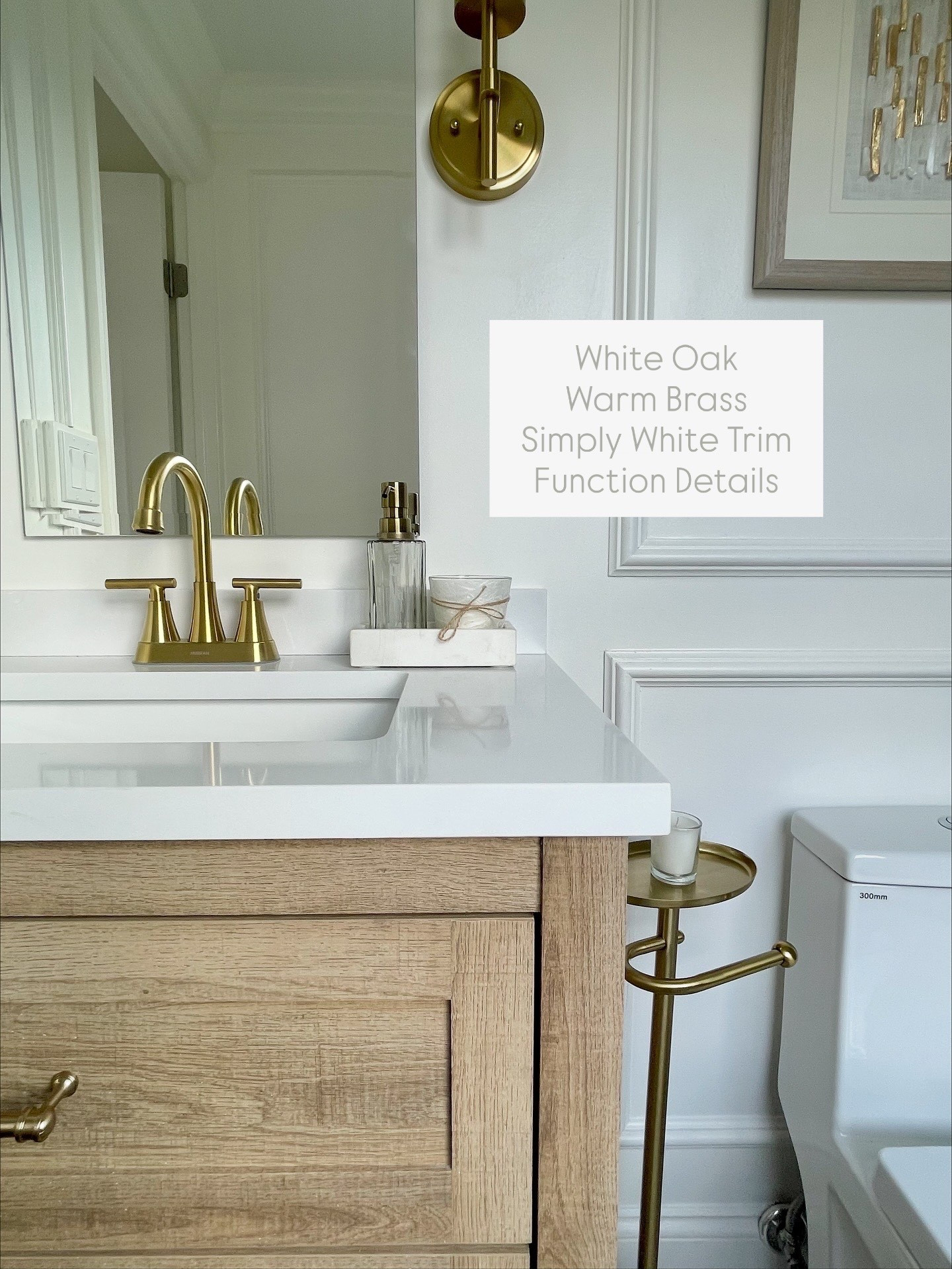 Primary Bathroom -Small on space, big in style! White oak vanity, warm brass faucet, sconce lighting and sweet accessories! Smaller scaled toilet to fit the space perfectly! Love that cute toilet paper holder with tray - such a fun Target find! 

#LTKHome