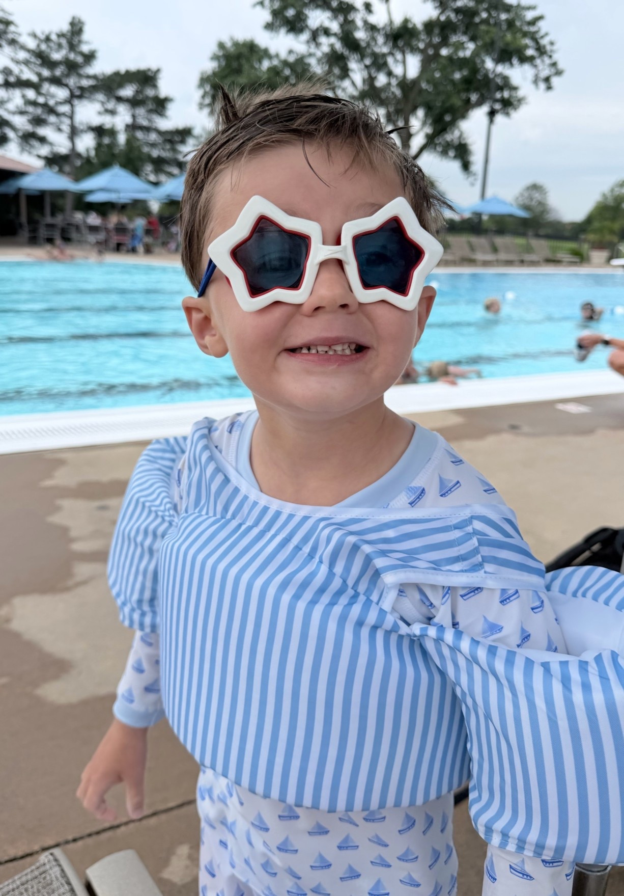 The most darling swim goggles for the 4th of July! I also love his striped puddle jumper for the 4th!