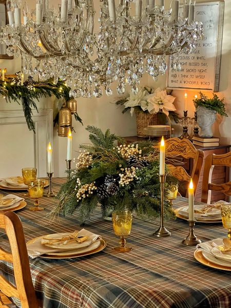 Christmas decorating in the dining room with rustic elegant touch. Neutral plaids with touches of gold and the ambiance of candles creates a cozy dining space.

Dining room, dining table, table cloth, greenery, chandelier, candles, taper candles, vintage candlesticks, flameless candles, mantel, garland, Christmas lights, fairy lights 

#LTKHoliday #LTKsalealert #LTKhome