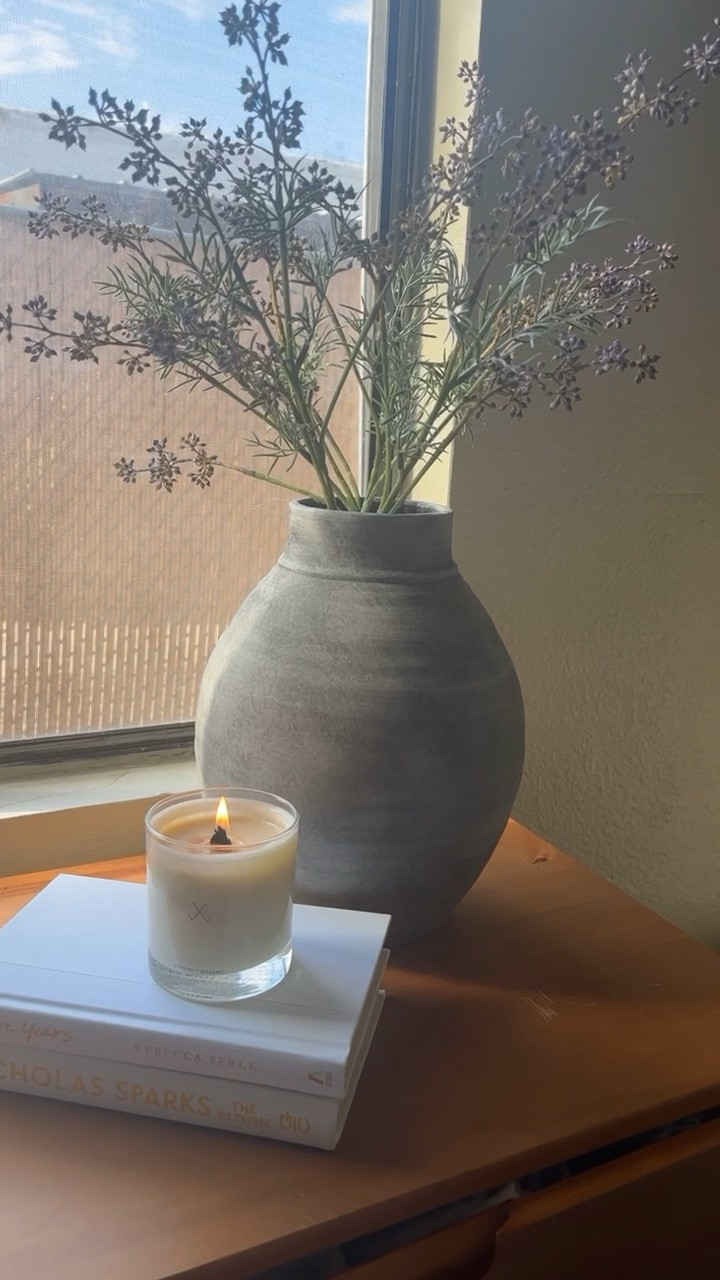 The perfect corner of my #bedroomdecor ! A beautiful vase with #fauxspringfloral stems and a delicious #springcandle to add scent to my room! This specific candle & vase are sold out but I linked similar scents that are currently in stock! Everything is linked! 

#LTKstyletip #LTKhome #LTKU