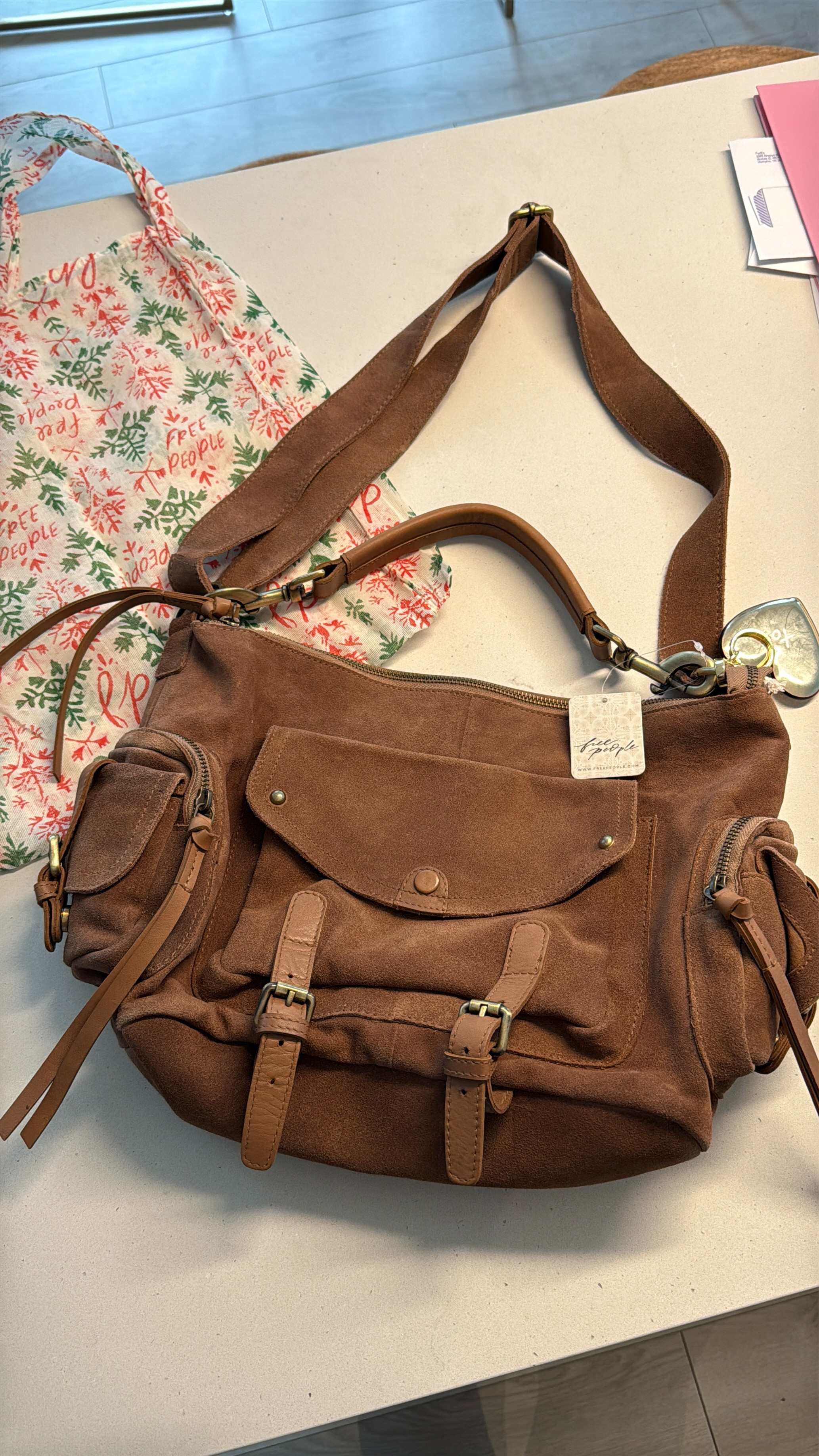 Is the viral Palermo bag from Free People really worth the hype? With over a dozen cargo pockets, a top handle plus adjustable shoulder strap and made of durable suede, I think so! 

#FreePeople #suedebag #handbagtrends  

 