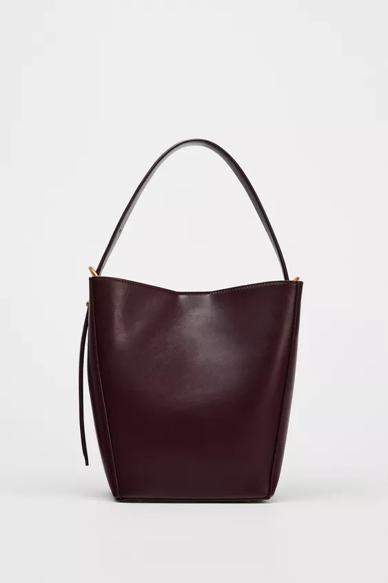 Bucket bag. Metal buckle detail at strap. Removable inner bag with zipper closure.Height x Length... | Zara US